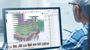 Man sat at monitor using Trimble Connect