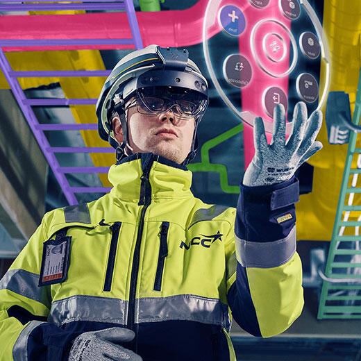 Construction worker using building information model data on a mixed reality hardhat