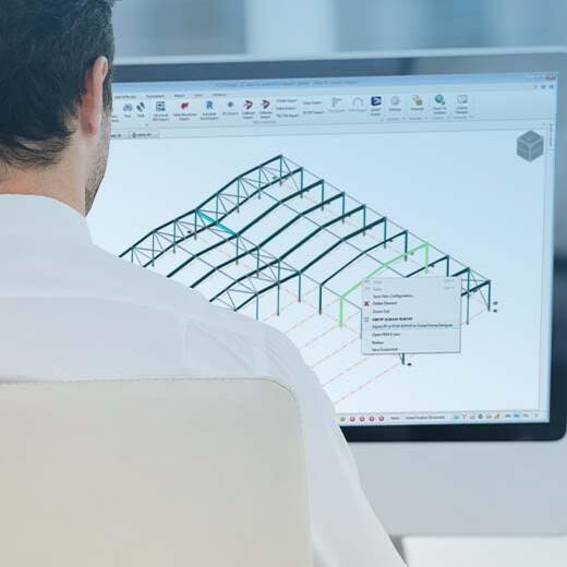 Engineer working with Tekla Portal Frame Designer in office