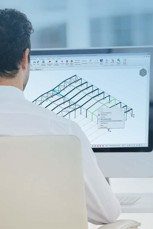 Engineer working with Tekla Portal Frame Designer in office