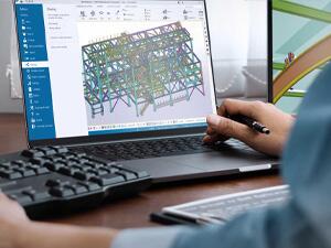 engineer using Tekla Model Sharing on a laptop