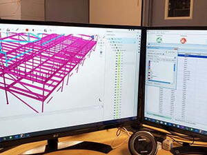 Two monitors showing Trimble Connect and Tekla PowerFab side-by-side